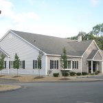 Exterior view of the dental office building with patient parking and main entrance