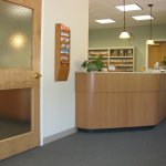 Dental office reception area with front desk and patient check-in counter