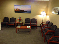 Comfortable dental office waiting room with seating and welcoming atmosphere