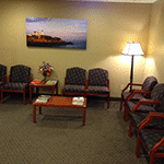 Comfortable dental office waiting room with seating and welcoming atmosphere