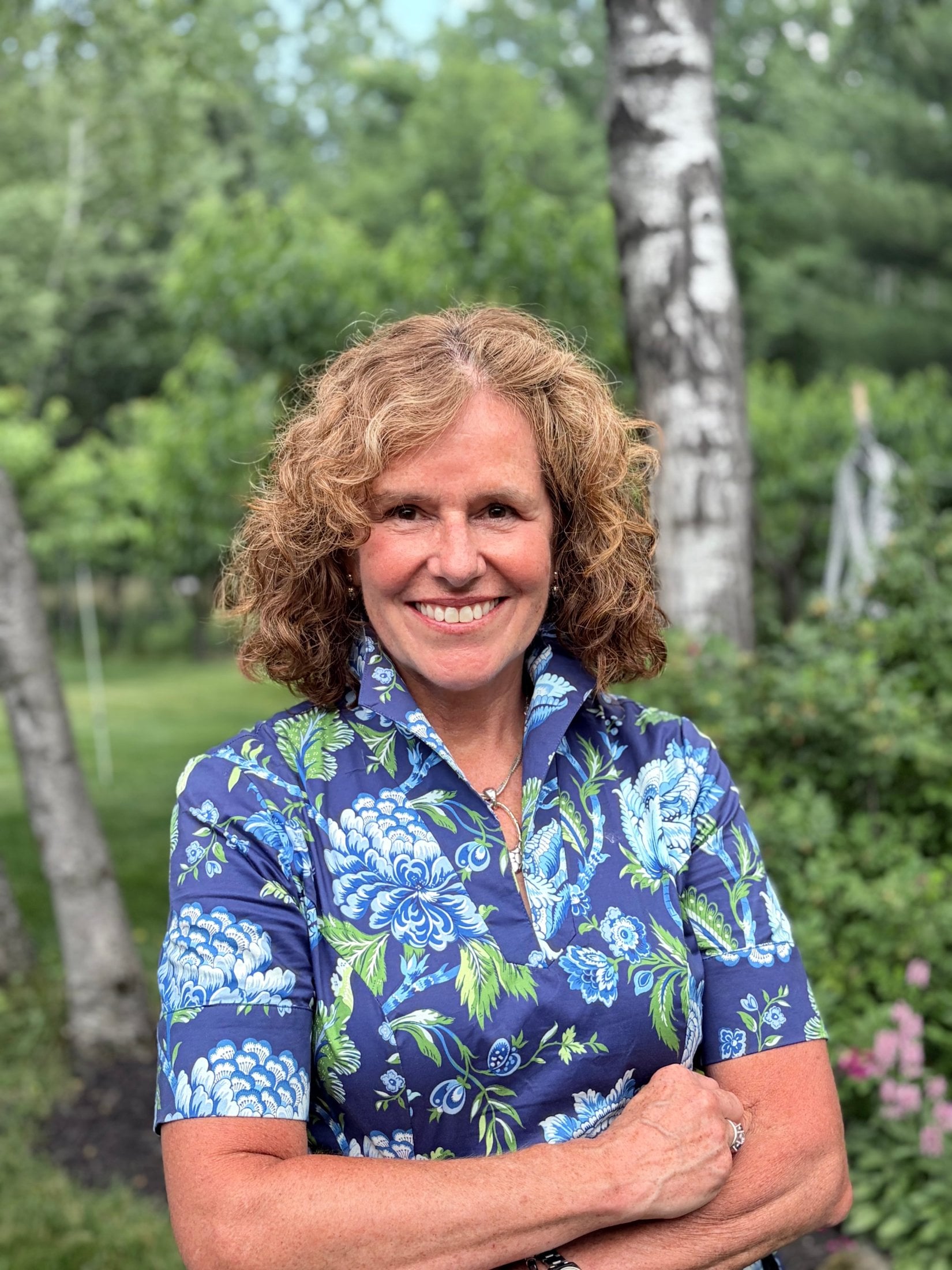 Portrait of Dr. Munn smiling outdoors in professional attire